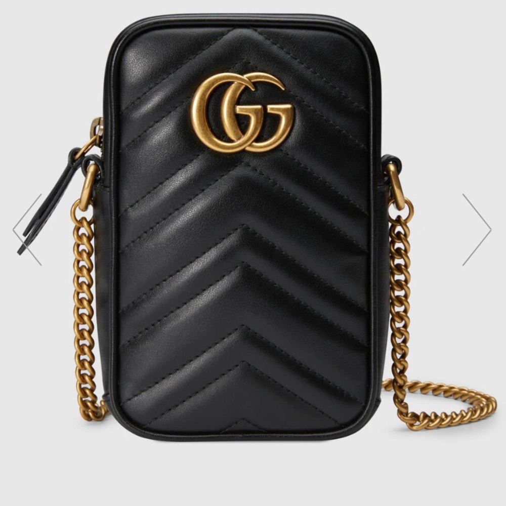 This is a brand new Gucci purse black 100% authentic worn 2 times
